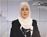 Voditeljica Fatma Nabil je svoj prvi nastop v nedeljskih televizijskih novicah opravila v črni obleki in z naglavno ruto kremne barve 